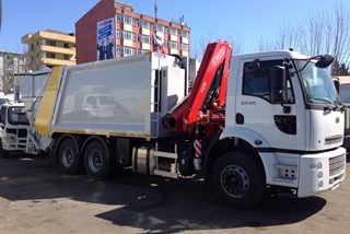 Refuse Truck with crane behind the cab