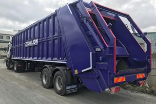 Refuse Transfer Trailer with Skip Loader Arm